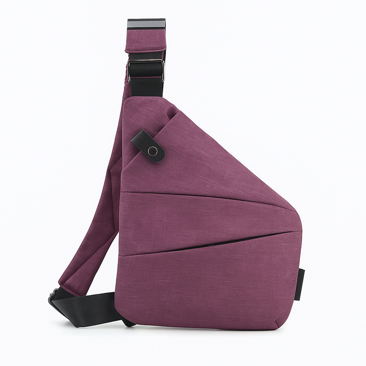 Liten men romslig unisex reiseveske, lett å bære som crossbody med justerbar reim.