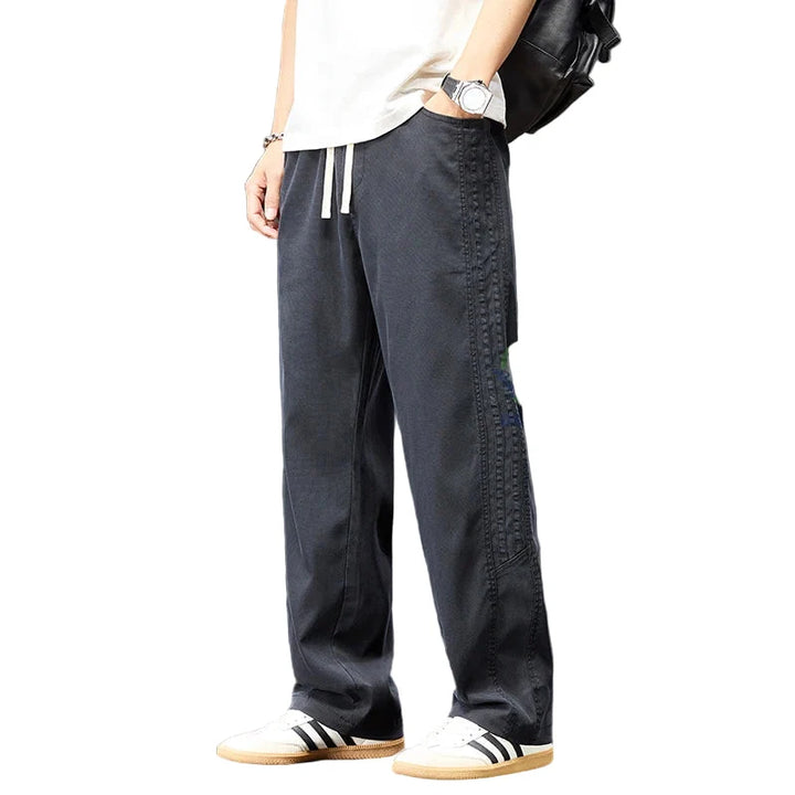 Herre streetwear bukser i lyocell, vide ben. Elastisk midje, komfortable joggebukser for alle størrelser.