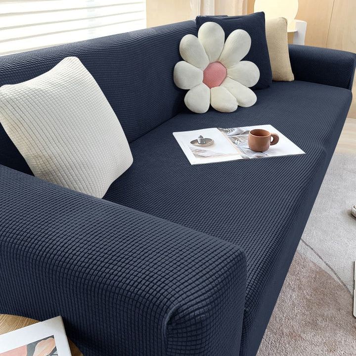 Elegant stretch sofatrekk med tekstur, perfekt for hjemmeinnredning og beskyttelse.