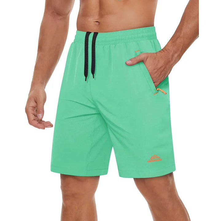 Sportsshorts til menn, ideell for trening, med praktiske glidelåslommer.
