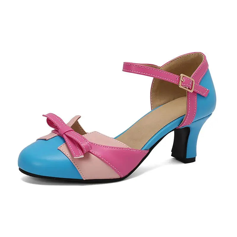 Brune elegante damepumps med sløyfe, rund tå og 6 cm hæl. Perfekt for kontor.