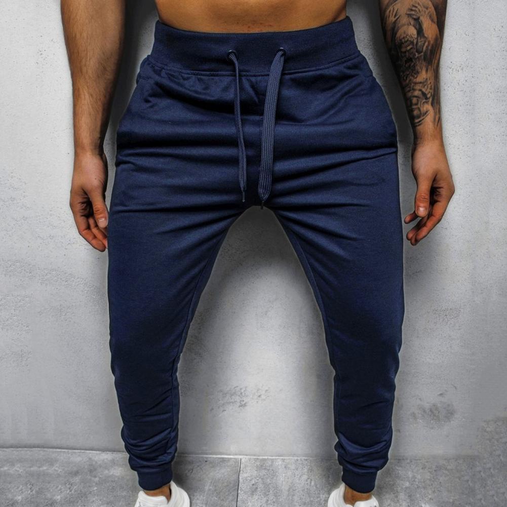 Herre treningsbukse slim fit med sidelinjer, gir bevegelsesfrihet og stil.