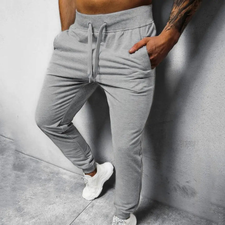 Sporty herre joggebukse i bomullsblanding, med slim passform og trendy sidelinjer.