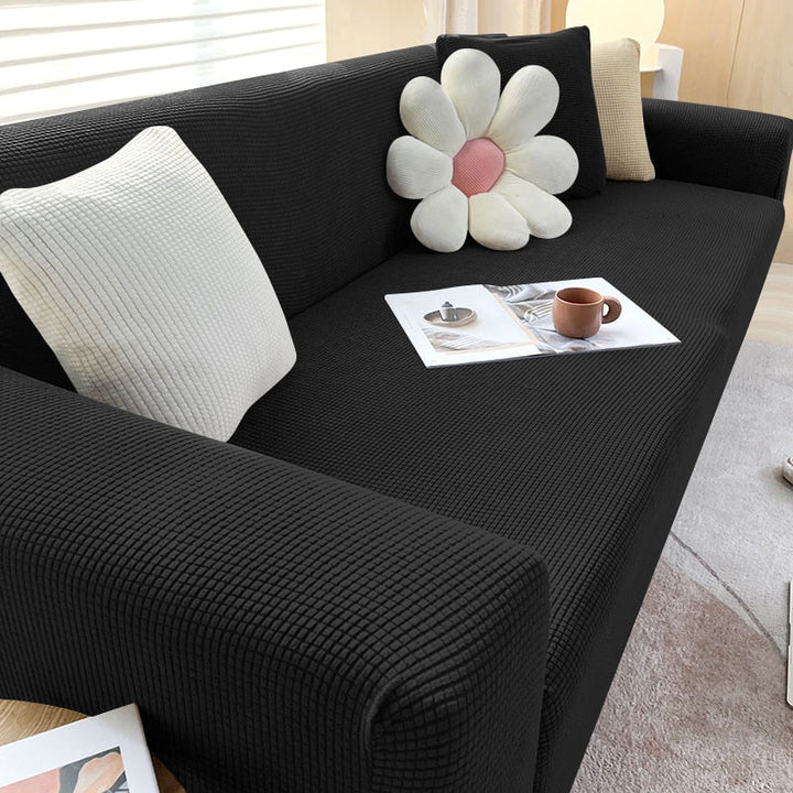 Sklisikkert sofatrekk som fornyer stuen og beskytter sofaen effektivt.