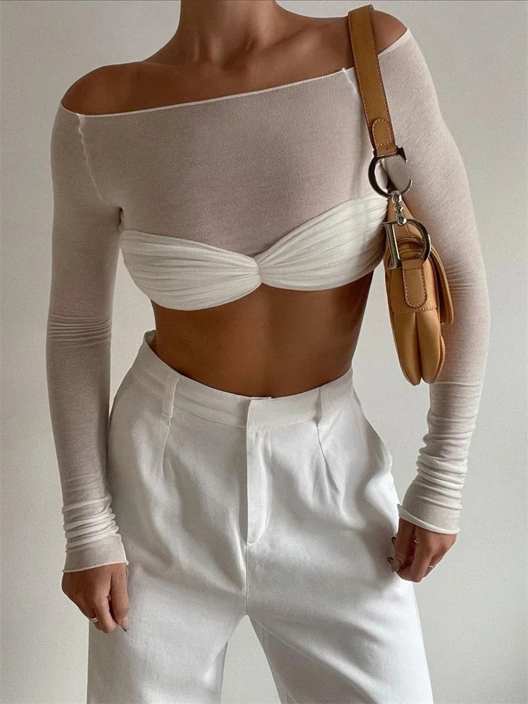 Allsidig gjennomsiktig mesh dametopp med lange ermer, ideell for trendy layering under blazere.
