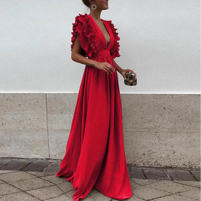 Kvinners elegante festkjole med delikate rynkede ermer i en tidløs farge.