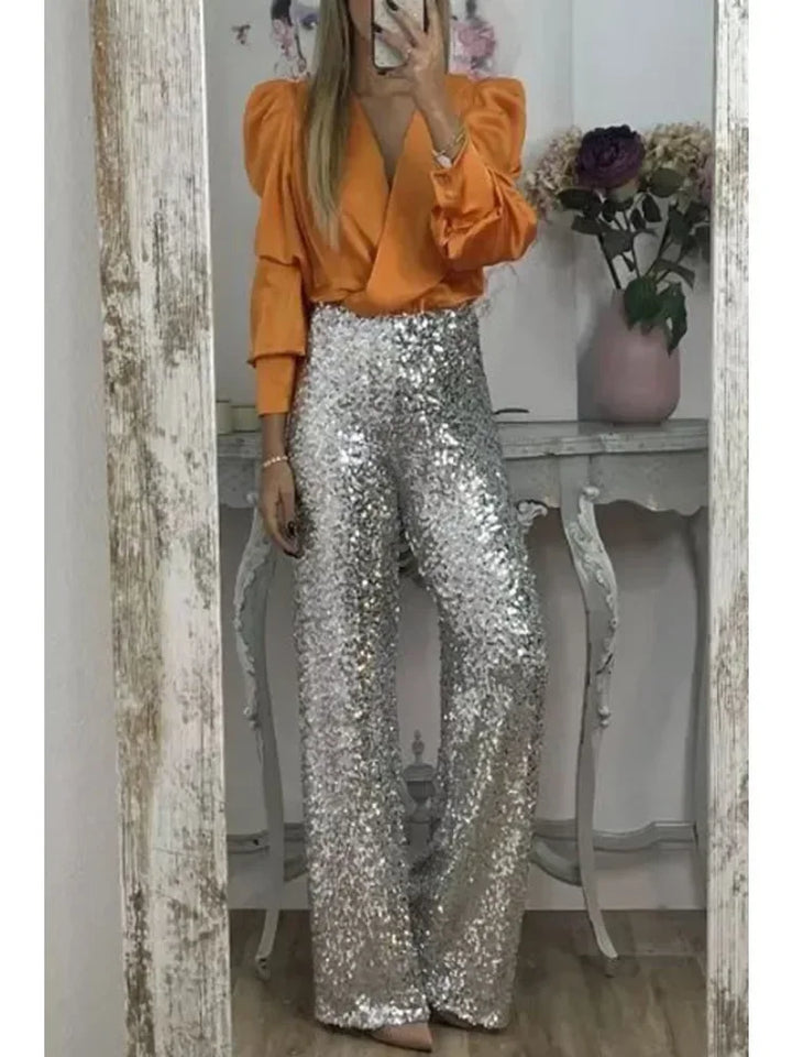 Svarte festbukser med glitrende paljetter for damer. Ideelle til fest, nyttår eller andre spesielle anledninger.