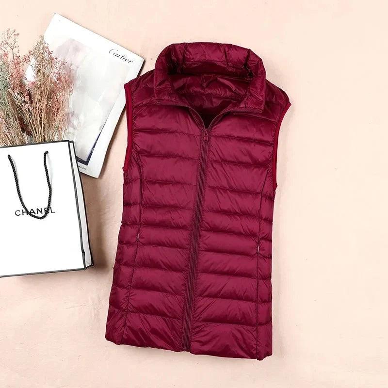 Dunvest til dame i hvit andedun, varm og komfortabel. Puffer vest for høst/vinter, plussize 8XL.