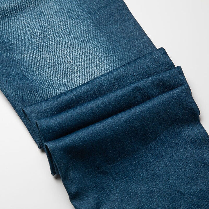 Grå jeans-leggings for kvinner med høymidje, fremhever slank silhuett og stil.