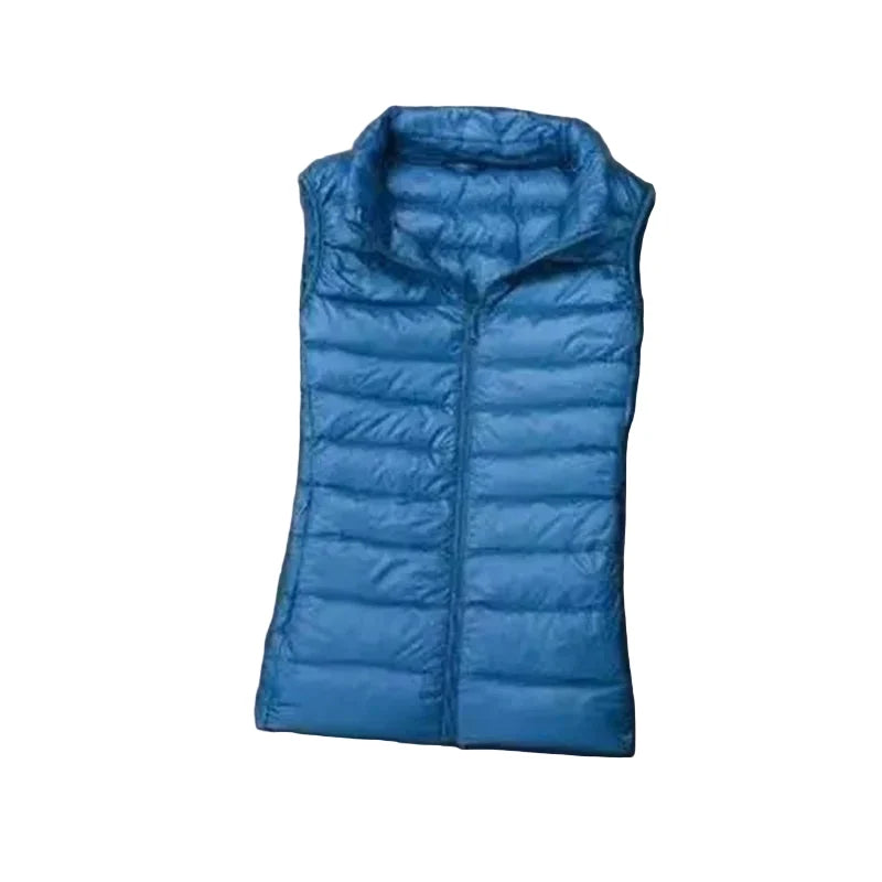 Dame puffer vest i hvit andedun, varm og komfortabel. Ultralett dunvest for høst og vinter.