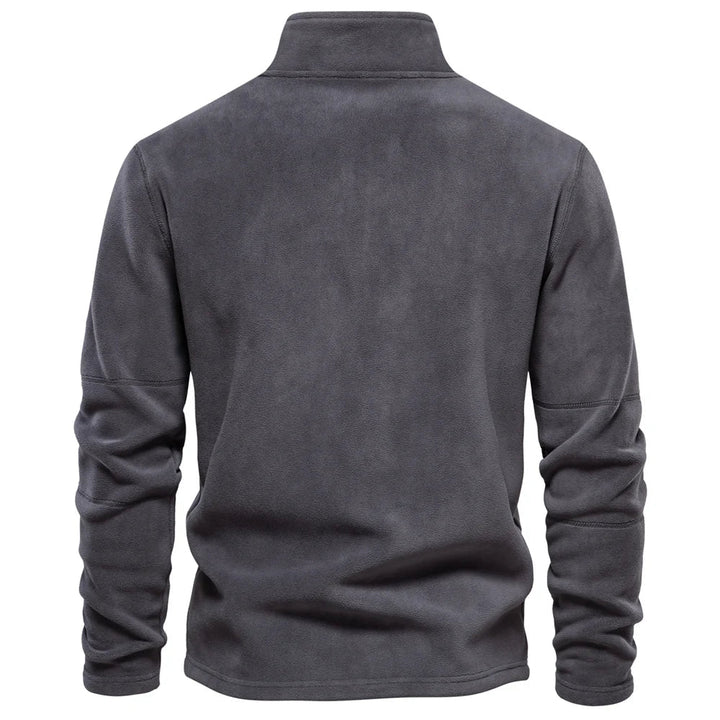 Sporty herre fleecegenser, varm og softshell-inspirert. Perfekt for utendørsaktiviteter med halv glidelås.