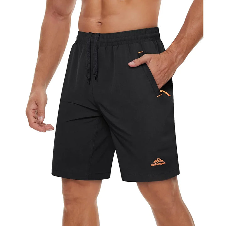 Herre treningsshorts, hurtigtørkende for løping og gym, med glidelåslommer.