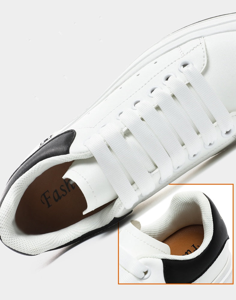 Moderne svarte og hvite sneakers for menn. Høydeøkende design med 6 cm usynlig hæl.