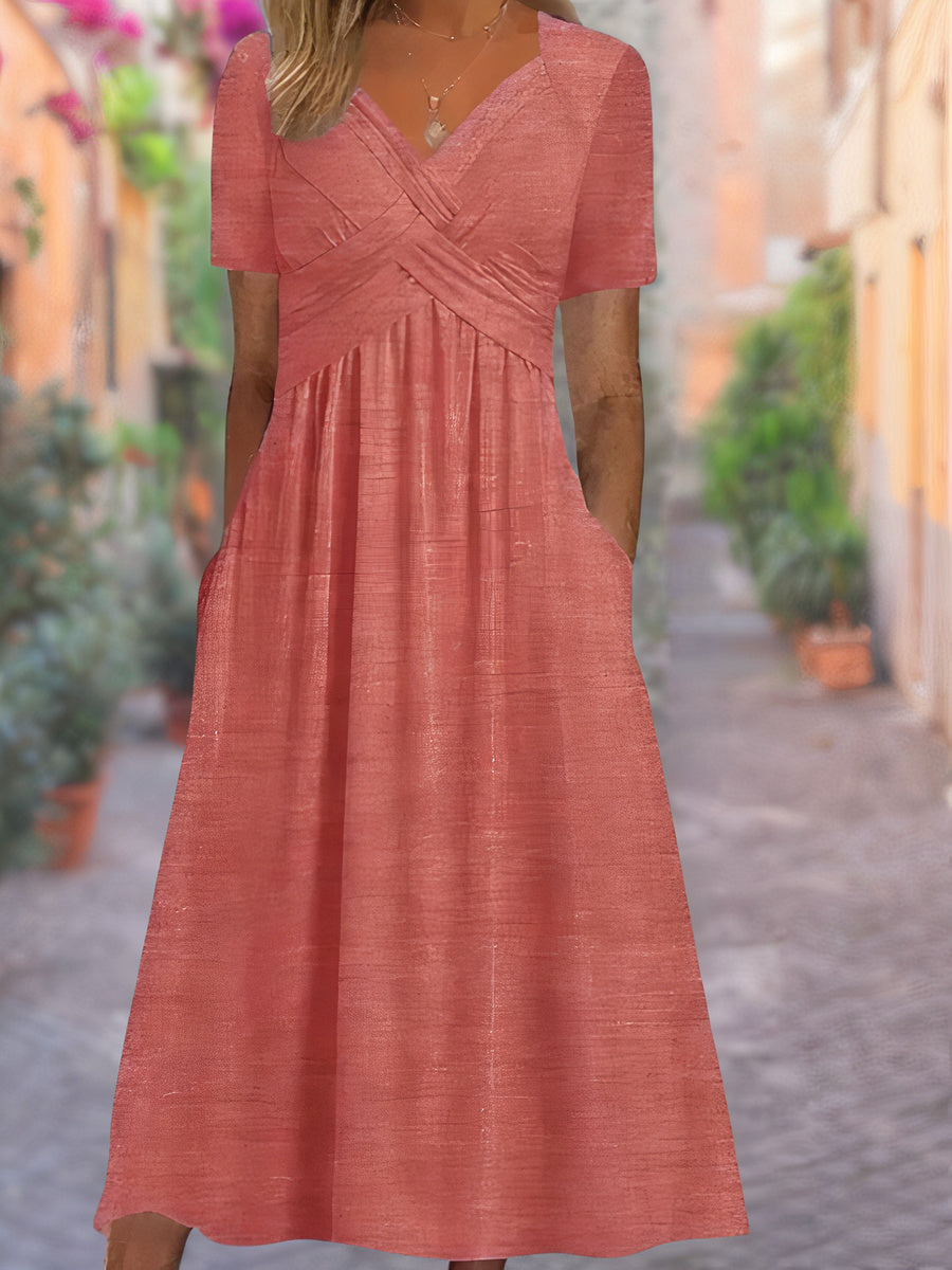 Komfortabel og lett hverdagskjole for dame med elegant V-hals, perfekt for sommermote.