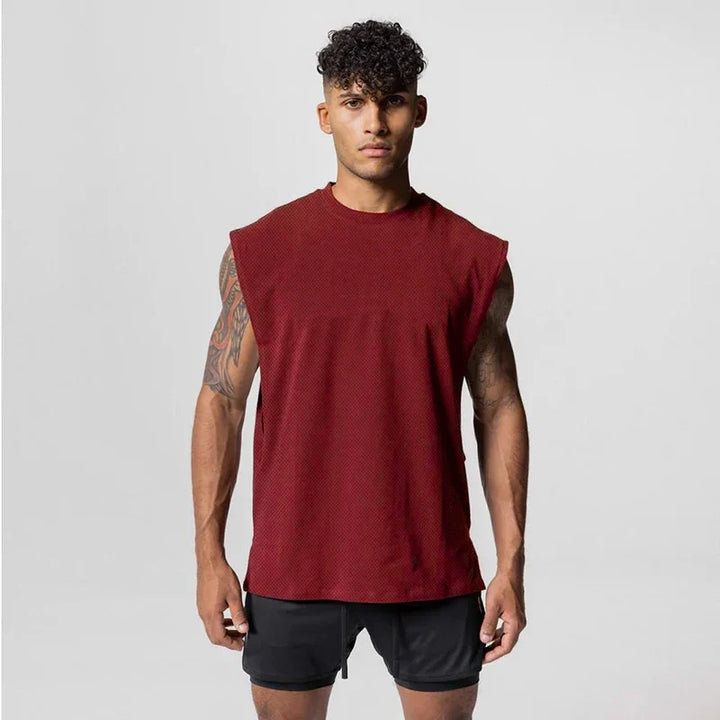 Grå herre fitness singlet, åpen side, ermeløs for maksimal bevegelsesfrihet.