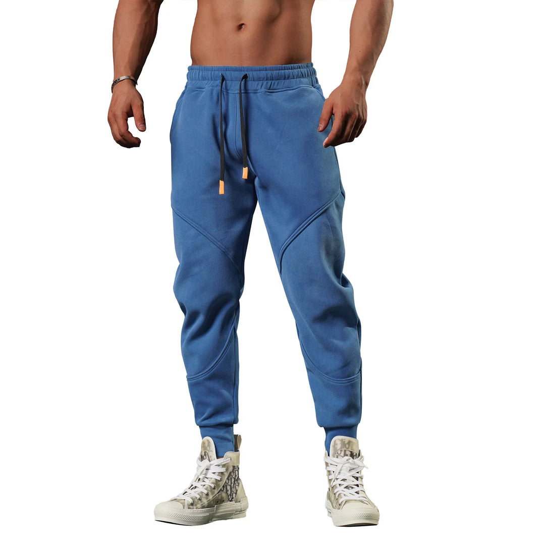 Fukttransporterende slim fit treningsbukse for menn, optimal for løping.