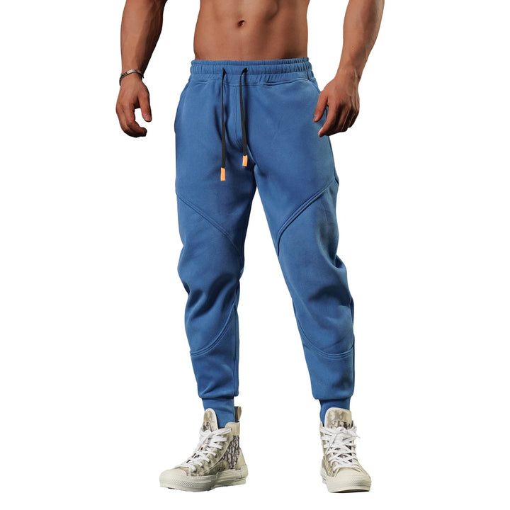 Treningsbukse for herre, slim fit, med praktiske lommer og elastisk linning.