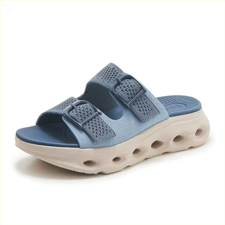 Slip-in sandaler for dame med justerbare spenner og ergonomisk tykk såle for optimal komfort.