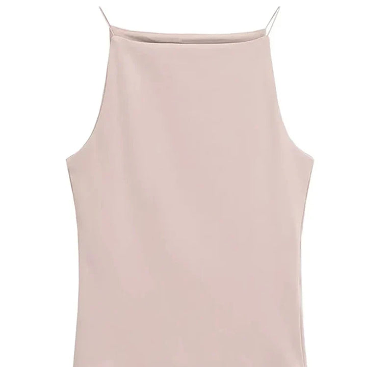 Stilfull ermeløs tanktopp for dame. Elegant haltertopp og ferieklær, perfekt for casual sommerbruk.