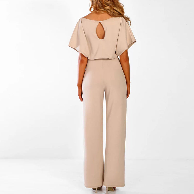 Trendy dame overall med brede ben, blonderdetalj og slank passform. Perfekt for sommerfest.