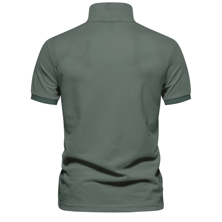 Mørkegrønn klassisk herre pique polo i bomull, perfekt for casual look.