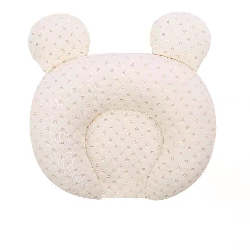 Ergonomisk babypute for nyfødte, forhindrer flatthode. Gir komfortabel støtte til spedbarns hode og nakke.