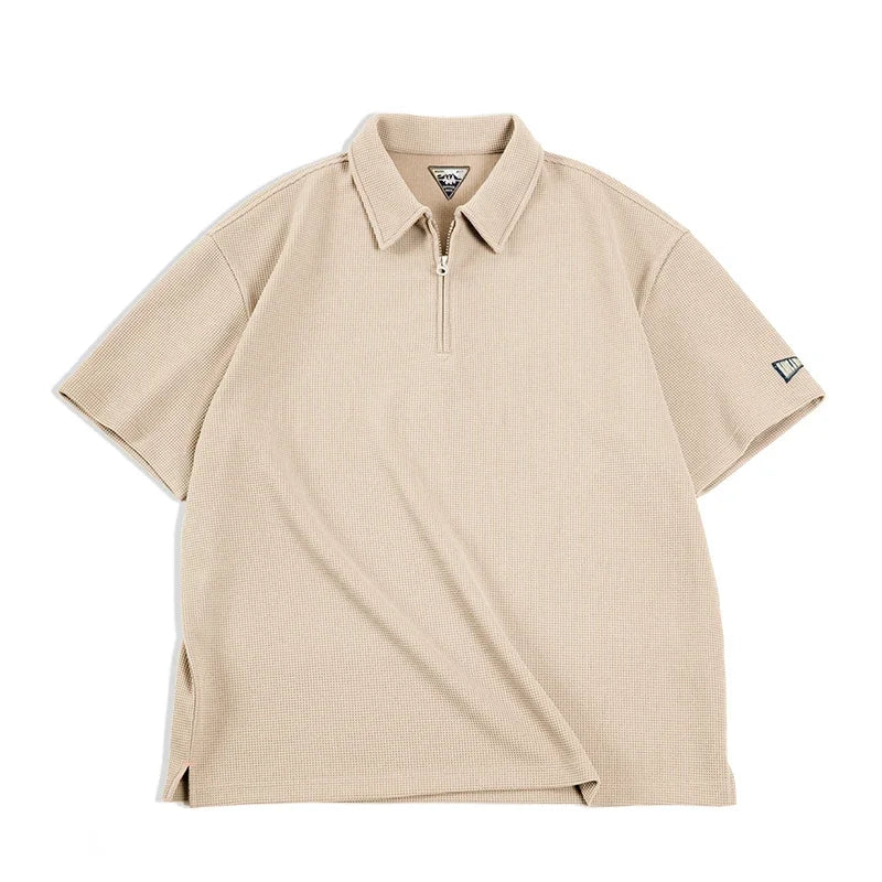 Klassisk grønn vintage herrepolo med vaffelstruktur og half-zip. Tidløs design for behagelig hverdagsbruk.