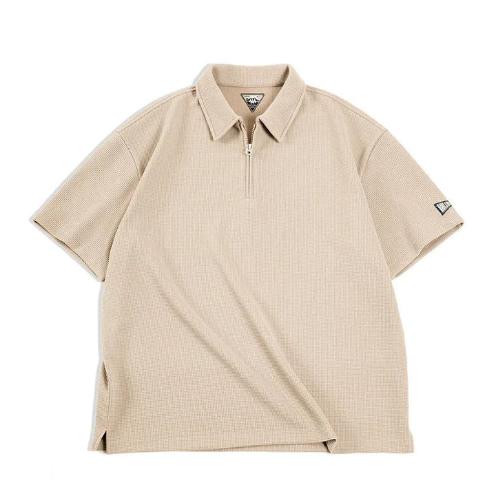 Klassisk grønn vintage herrepolo med vaffelstruktur og half-zip. Tidløs design for behagelig hverdagsbruk.