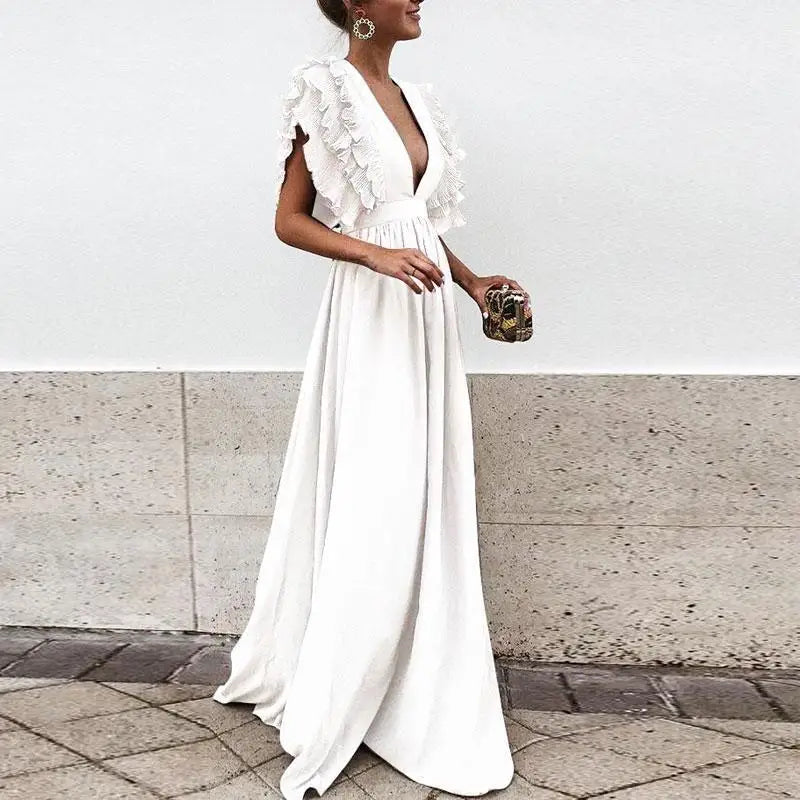 Trendy kvinnekjole med elegante rynkede ermer for et sofistikert utseende. Komfortabel hverdagskjole.