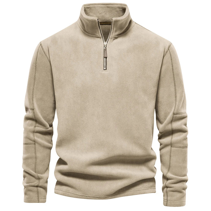Isolerende herre fleecegenser med halv glidelås, et varmt mellomlag som ligner softshell. Høy komfort.