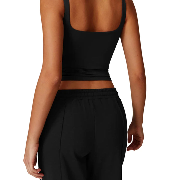 Elegant dame singlet med sports-BH, designet for maksimal komfort under trening.