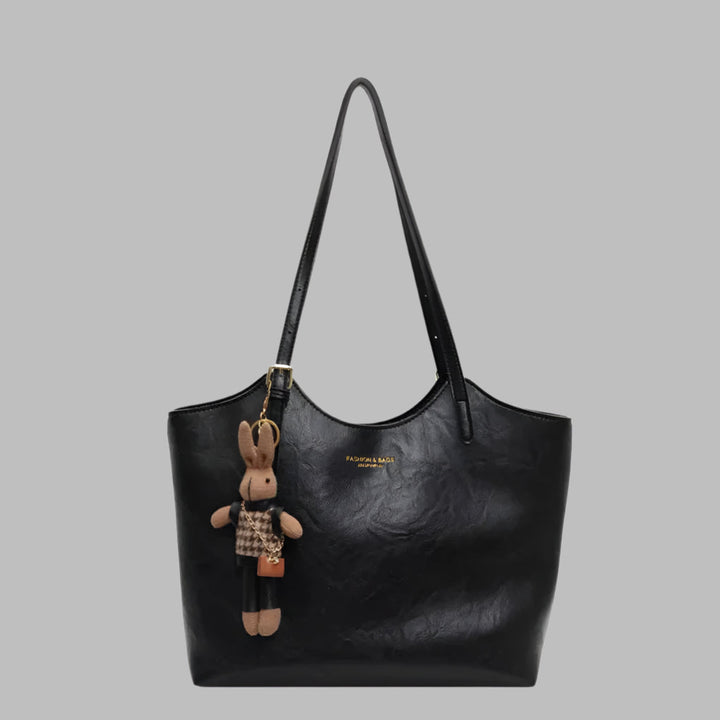 Rød vintage skulderveske i mykt skinn, en elegant og romslig toteveske for damer, perfekt for jobb og fritid.