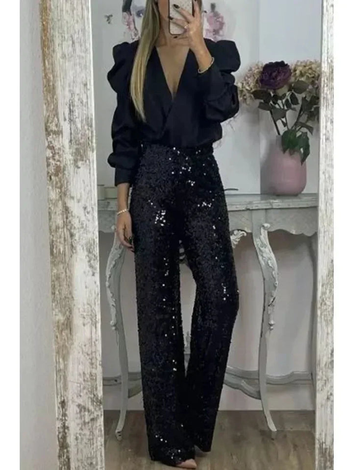 Kvinnebukser med skinnende paljetter for en glamorøs look. Elegant og komfortabel festbukse med elastisk midje.
