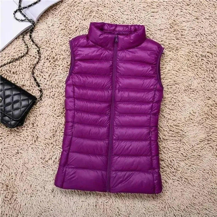 Hvit dame dunvest i andedun, varm og komfortabel. Puffer vest for plussize, perfekt for vinter.