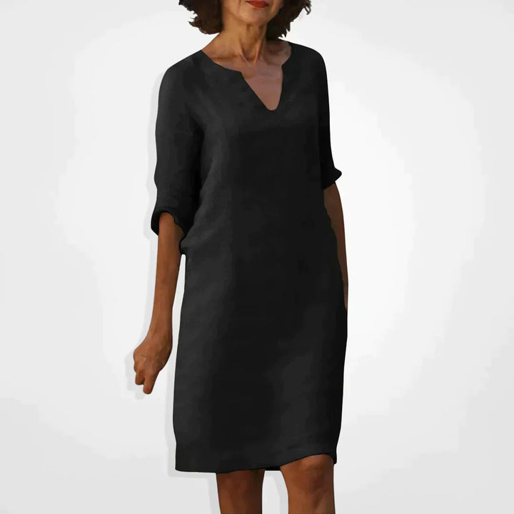 Elegant dame sommerkjole med V-hals, trekvart ermer. Perfekt midi kjole for fest eller hverdag.
