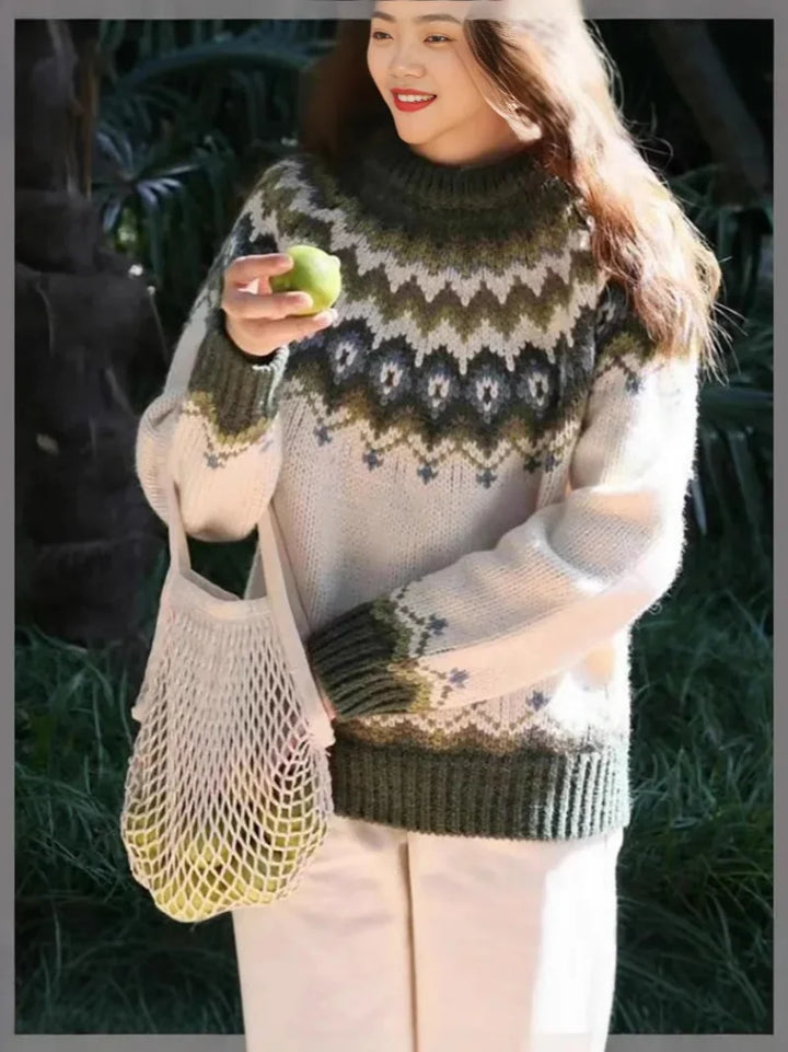 Elegant strikkegenser med fargeblokkmønster og rund hals for kvinner. Løs og feminin passform.
