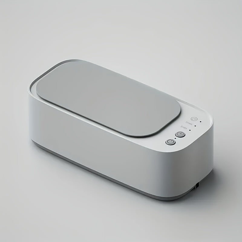Ultrasonisk rensermaskin med smykker, klokke og briller klar for grundig dyprens.
