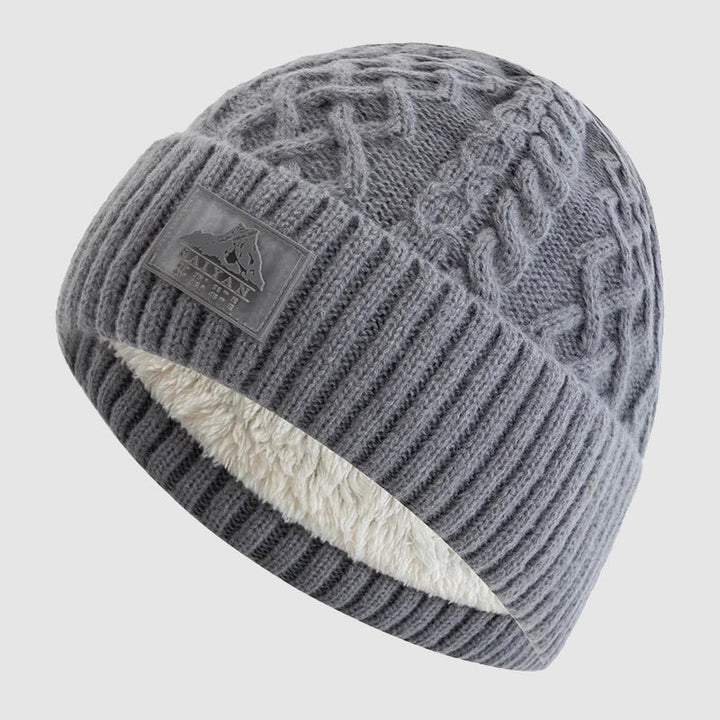Tidløs unisex strikket lue i akryl med isolerende fleece. Allsidig tilbehør for mote og funksjon.