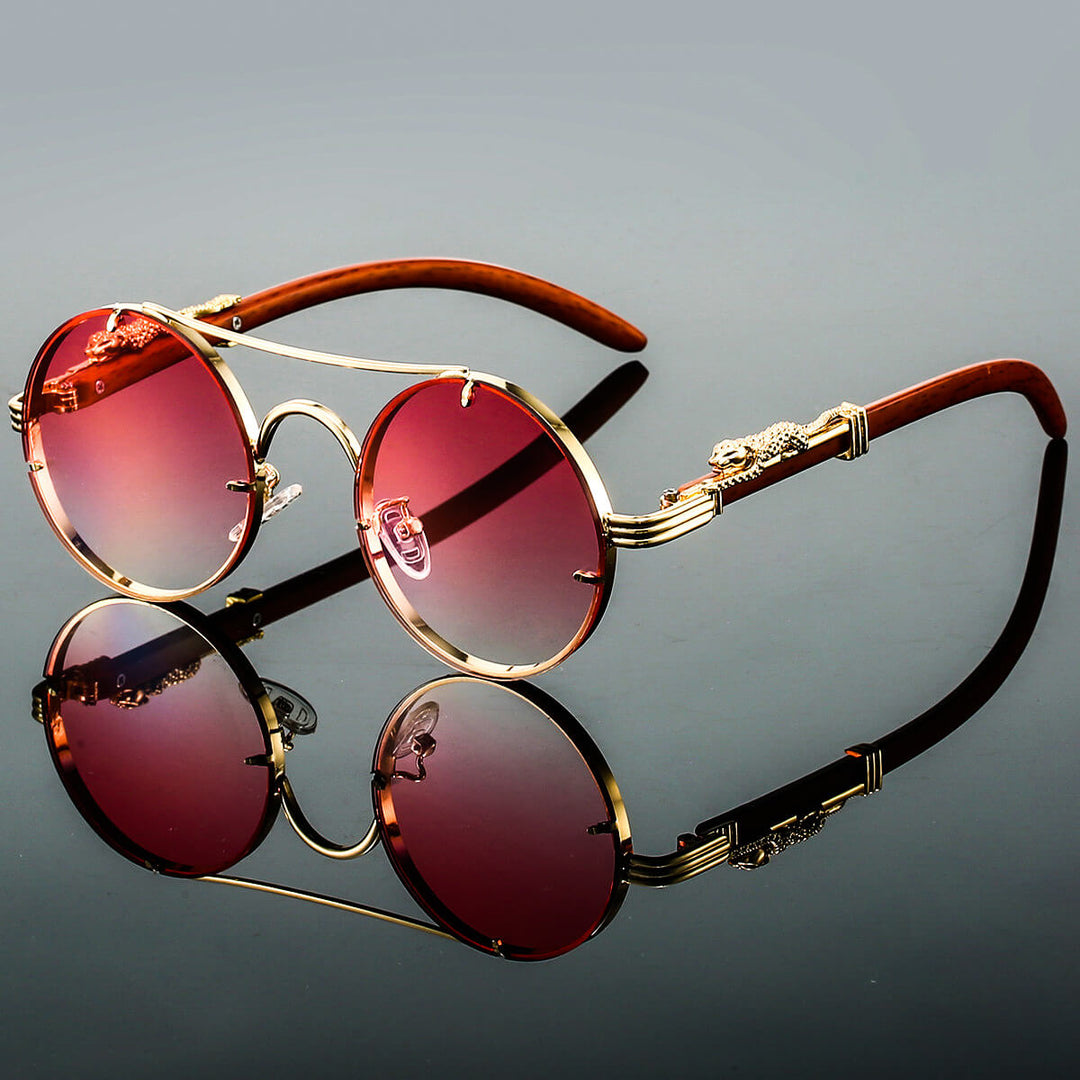 Klassiske ovale retro solbriller, unisex design med slank metallramme. Trendy og med UV-beskyttelse.