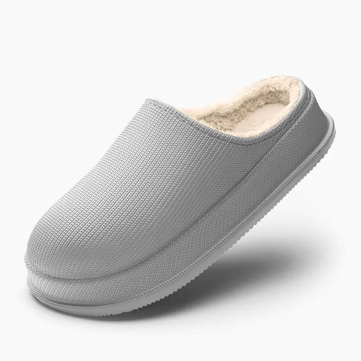 Varmende unisex tøfler med innvendig ullfôr og sklisikker såle for sikkerhet hjemme.