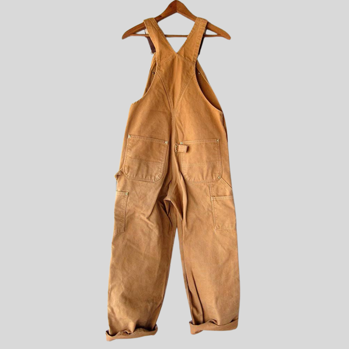 Retro damesnekkerbukser i løs passform, oransje denim. Komfortable overalls for hverdagsbruk og bevegelse, damemote.
