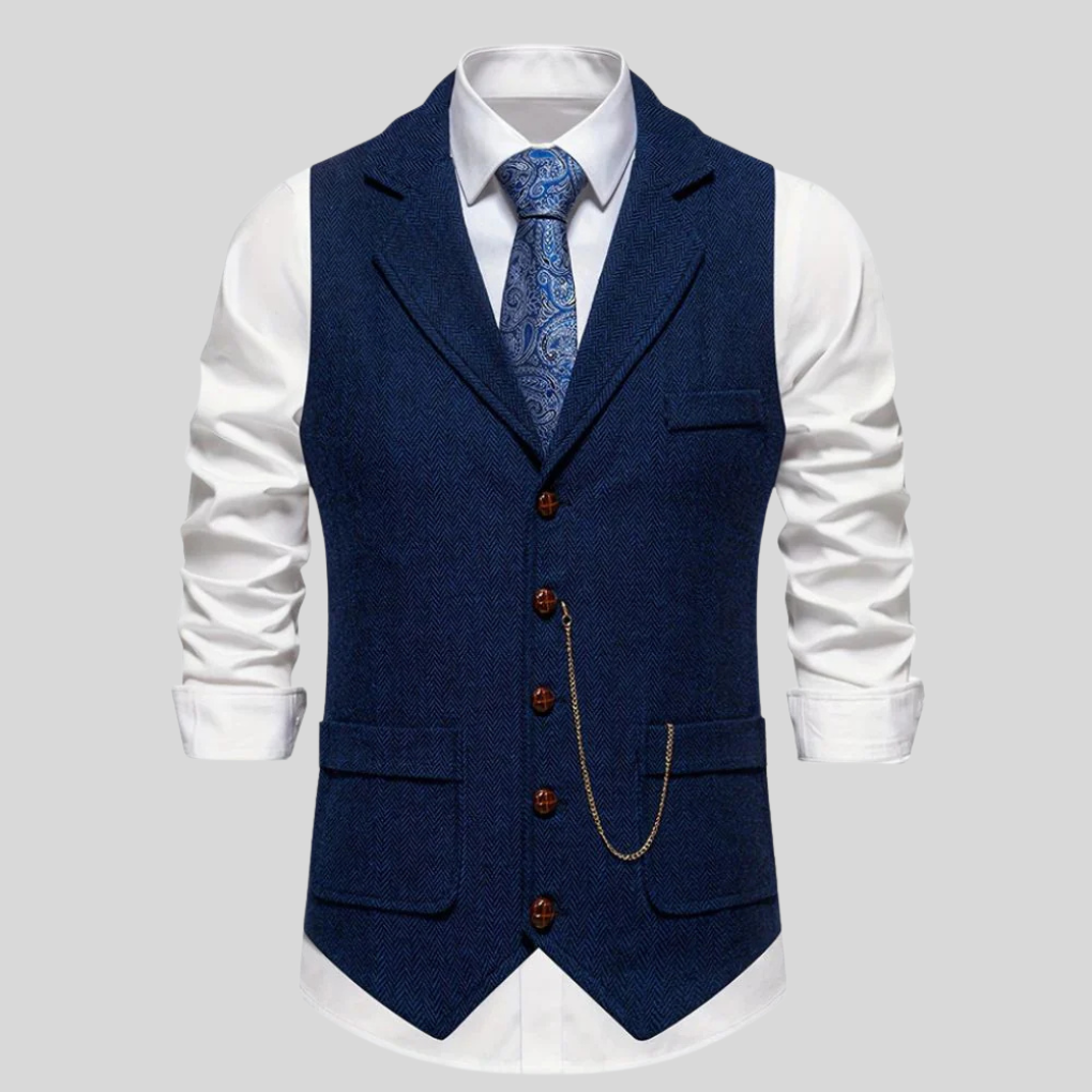 Elegant marineblå fiskebensvest for menn. Stilfull ullblanding, ideell som formell dressvest til bryllup.