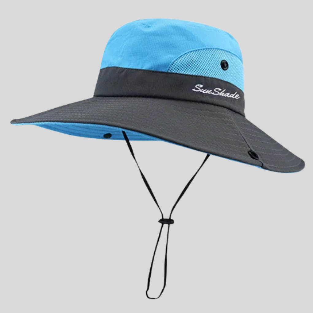 Elegant lilla sommerhatt med bred brem for kvinner, gir optimal solbeskyttelse på stranden eller ferie.