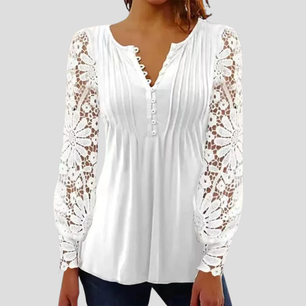 Elegant kvinnetopp sett bakfra, fremhever det stilfulle designet. Komfortabel og allsidig dametopp.