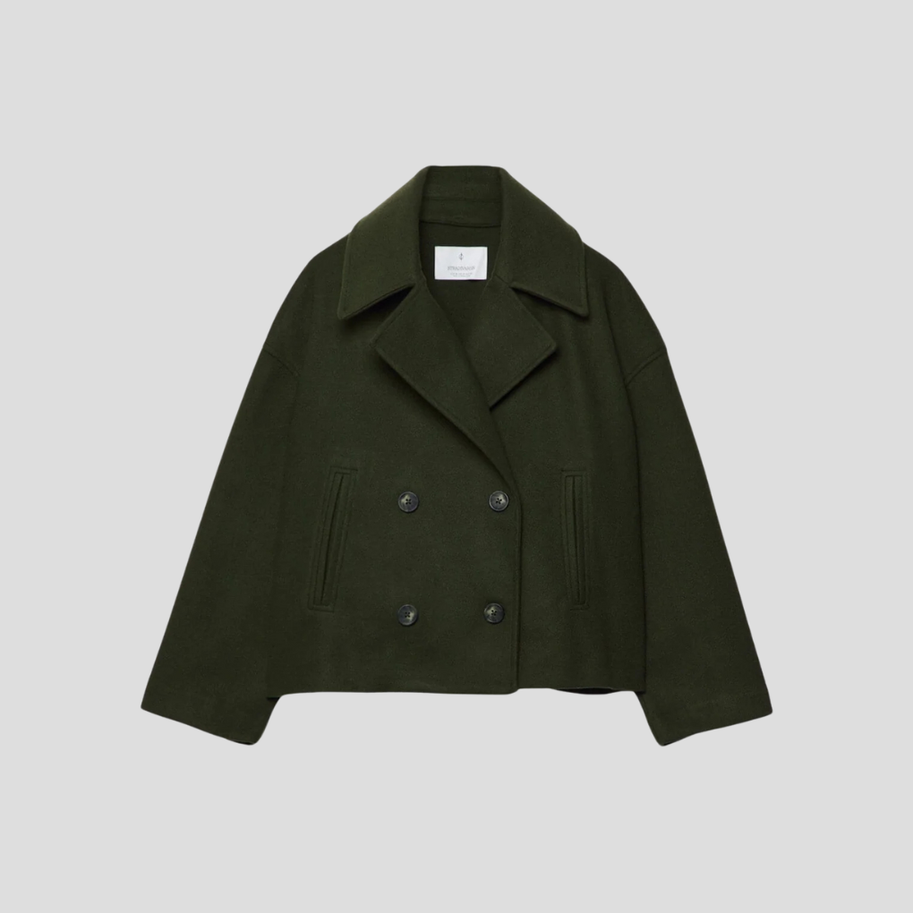 Trendy kvinnejakke, kort dobbeltknappet frakk. Ideell for kontorstil eller som moteriktig yttertøy.