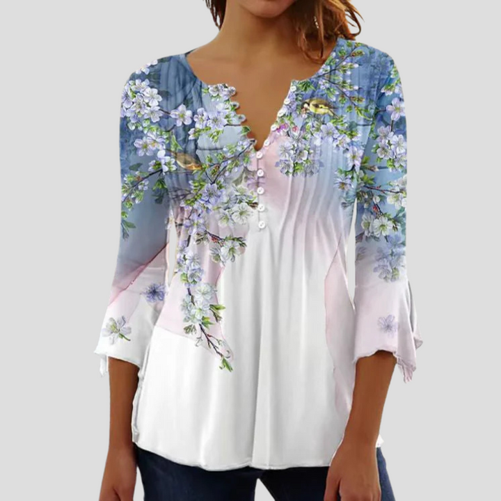 Elegant bluse/kvinnetopp for vår og sommer. Komfortabel og stilfull, ideell for enhver garderobe.