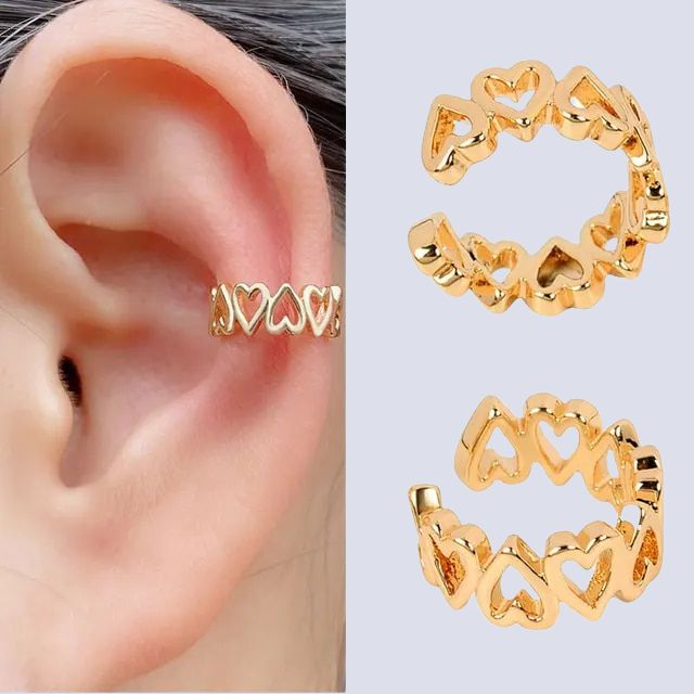 Mote-favoritt spiral øremansjett i gull. Et must-have for en trendy look uten piercing.