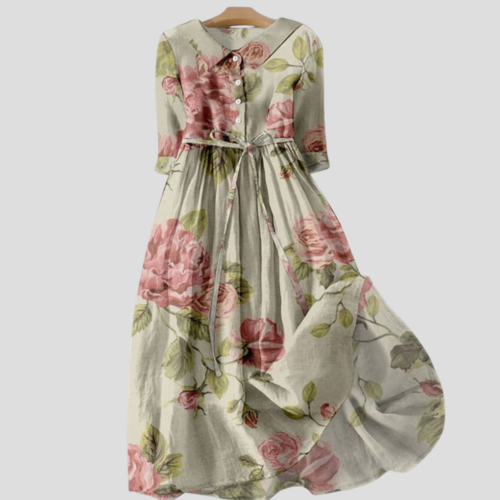 Elegant damekjole med botanisk blomstertrykk, klassisk krage, og komfortabel midilengde for hverdag eller fest.