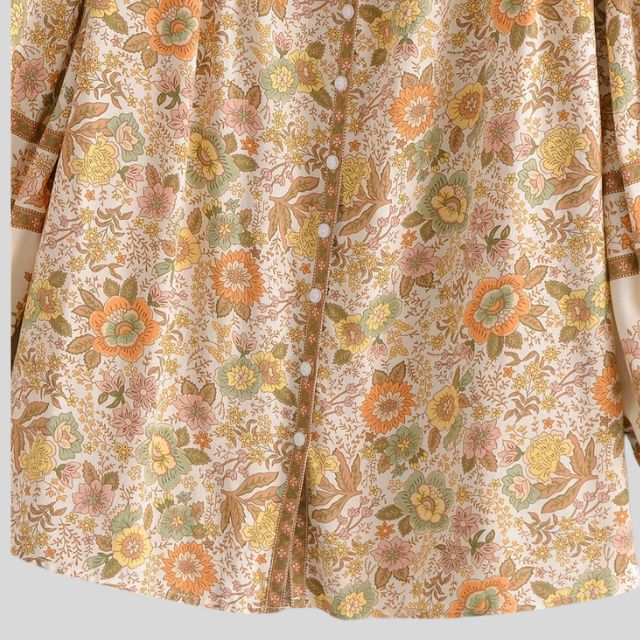 Elegant langermet sommerbluse i topas, bohemsk med diskrete duskdetaljer for et sofistikert uttrykk.
