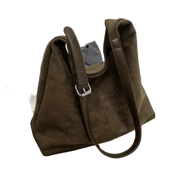 Stilfull dameveske, romslig og allsidig. Kan brukes som skulderveske eller crossbody med justerbar stropp.